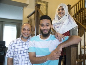 Sajjad Ullah, left, is hosting a feast today for more than 150 residents of the Salvation Army?s Centre of Hope in London as a wedding gift to son Ahnaf Ullah, centre, and his bride, Jaima Theethe. (DEREK RUTTAN, The London Free Press)
