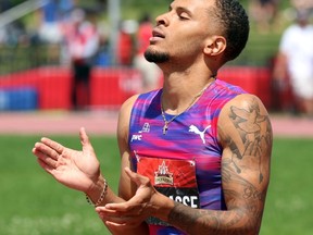 Andre De Grasse reacts after winning gold in the men's 200-metre race at the Canadian Track and Field Championships in Ottawa on July 9, 2017. (THE CANADIAN PRESS/Fred Chartrand)