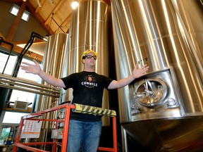 Stephen Rich, brewmaster of the new Cowbell Brewery in Blyth, shows off the production area during a media tour Thursday. The brewery, above, opens next week and will employ about 100 people. (MORRIS LAMONT, The London Free Press)