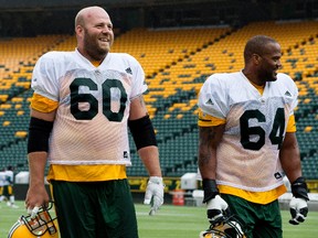 Justin Sorensen and D'Anthony Batiste leave the field following an Edmonton Eskimos practice at Commonwealth Stadium, in Edmonton Tuesday July 11, 2017. The two will start against the Hamilton Tiger-Cats on Friday.