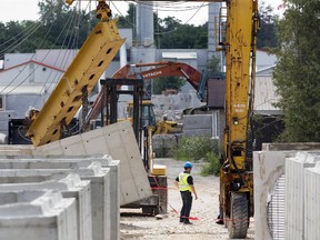 A damaged crane sits idle Thursday on the property of Coldstream Concrete where an industrial accident cost a man his arm a day earlier.  (DEREK RUTTAN, The London Free Press)