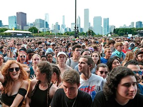 Fans gather as Liam Gallagher performs on Day 1 of Lollapalooza in Grant Park on Thursday, Aug. 3, 2017 in Chicago. (Rob Grabowski/Invision/AP)