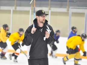 Keeping watch of those trying out for the Mitchell Jr. C Hawks during their opening night of training camp Aug. 1 was new head coach Joel Riley. Camp continues this week, Aug. 9 and 11. ANDY BADER/MITCHELL ADVOCATE