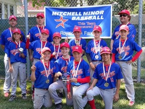 Members of the Mitchell Pee Wee OBA baseball team celebrate their tournament victory in Chatham July 30. SUBMITTED