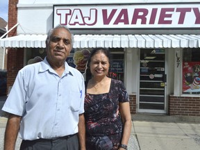 Roger and Gurmeet Banga stand in front of Taj Variety, a store Roger bought for a little more than $80,000 in 1990. Now he’s looking to sell the property but despite a steady stream of income, can’t find a buyer from Chatham-Kent.