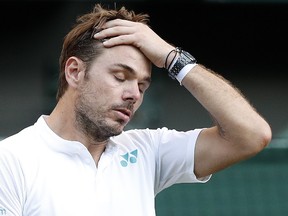This file photo taken on July 03, 2017 shows Switzerland's Stan Wawrinka reacting against Russia's Daniil Medvedev during their men's singles first round match on the first day of the 2017 Wimbledon Championships at The All England Lawn Tennis Club in Wimbledon, southwest London. (Adrian Dennis/AFP/Getty Images)