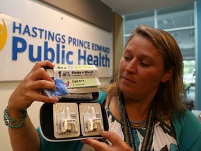 Jason Miller/The Intelligencer
Stephanie McFaul, program manager at Hastings Prince Edward Public Health, displays one of the Naloxone kits available to the public. A recent spike in overdoses has local health officials encouraging drug users to exercise caution when using illicit drugs.