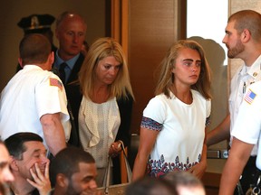 Followed by her parents, Michelle Carter arrives for her sentencing at a courtroom in Taunton, Mass., Thursday, Aug. 3, 2017, for involuntary manslaughter for encouraging Conrad Roy III to kill himself in July 2014. (Matt West/The Boston Herald via AP, Pool)