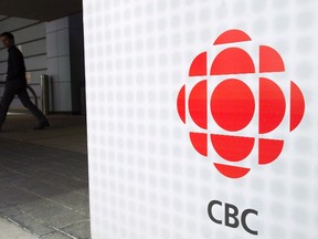 A man leaves the CBC building in Toronto on Wednesday, April 4, 2012. THE CANADIAN PRESS/Nathan Denette