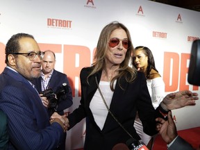 Kathryn Bigelow, director of the film "Detroit," meets Dr. Michael Eric Dyson on the red carpet before the premiere of "Detroit" at the Fox Theatre, Tuesday, July 25, 2017, in Detroit. The movie is set in the summer of 1967 where rioting and civil unrest teared apart the city of Detroit. (AP Photo/Carlos Osorio)