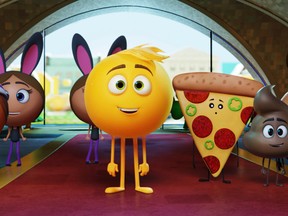 This image released by Sony Pictures shows Gene, voiced by T.J. Miller, center, in Columbia Pictures and Sony Pictures Animation's "The Emoji Movie." (Sony Pictures Animation via AP)