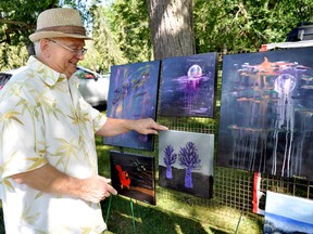 Local artist Richard Martin displays some of his work in Springbank Park, a tradition artists in London have been enjoying for about 40 years. (CHRIS MONTANINI/LONDONER/POSTMEDIA NETWORK)