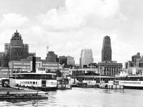 The Toronto skyline of 1957 forms the background for the Trillium and Thomas Rennie moored at the old Toronto Island Ferry Docks near the foot of York St. Note the city’s prominent skyscrapers of the day, the 1929 Royal York Hotel and 1930-31 Bank of Commerce Building.