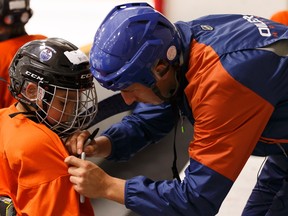 Edmonton Oilers forward Ryan Strome signs the jerseys of young players enrolled in the Oilers Hockey School at Servus Credit Union Place in St. Albert on Friday, August 4, 2017.