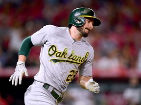 Matt Joyce #23 of the Oakland Athletics runs on his RBI double to take a 6-2 lead over the Los Angeles Angels during the sixth inning at Angel Stadium of Anaheim on August 4, 2017 in Anaheim, California. (Photo by Harry How/Getty Images)