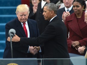 US President Barack Obama (R) greets President-elect Donald Trump as he arrives on the platform at the US Capitol in Washington, DC, on January 20, 2017, before his swearing-in ceremony. MANDEL NGAN/Getty Images