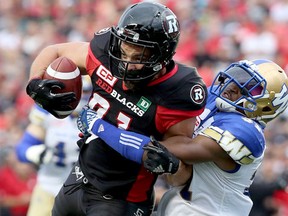 Ottawa’s Patrick Lavoie runs into Winnipeg’s Moe Leggett on a carry during action at TD Place in Ottawa Friday, August 4, 2017. (Julie Oliver/Postmedia Network)