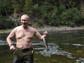 Russian President Vladimir Putin fishes in the remote Tuva region in southern Siberia. The picture taken between August 1 and 3, 2017. ALEXEY NIKOLSKY/Getty Images