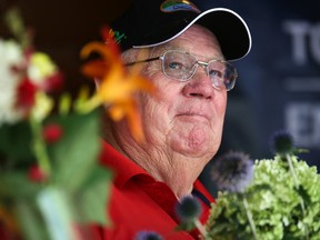 Quinte West Mayor Jim Harrison waits on stage for an arrangement of flowers he made to be auctioned off as part of Walts Sugar Shack Shindig on Saturday August 5, 2017 in Prince Edward County, Ont. The event was a fundraiser for the Trenton Military Family Resource Centre. Tim Miller/Belleville Intelligencer/Postmedia Network