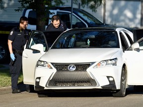 Edmonton police investigate a shooting near 130 Street and 129 Avenue on Sunday, August 6, 2017. The shooting took place around 10 p.m. Saturday night. Shaughn Butts/Postmedia