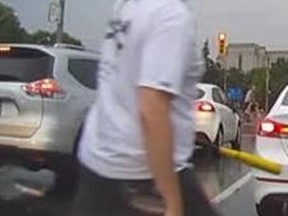 Toronto Police are seeking a man in connection to an alleged road rage incident. The man shown in this video screengrab, allegedly smashed a passenger-side mirror of a car after getting into a verbal altercation with another man. (SUPPLIED)