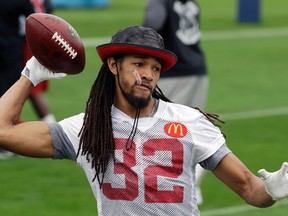 This Feb. 3, 2017 file photo shows Atlanta Falcons cornerback Jalen Collins (32) throwing during a practice for the NFL Super Bowl 51 football game in Houston. (AP Photo/Eric Gay)