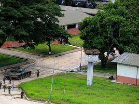 Soldiers patrol inside the Paramacay military base in Valencia, Venezuela, Sunday, Aug. 6, 2017. According to the government earlier in the day, troops quickly put down an attack at the army base on Sunday, clashing with a group that said it was out to “re-establish the constitutional order” but was dismissed by officials as a band of civilians working with a deserted lieutenant and a former officer. (AP Photo/Juan Carlos Hernandez)