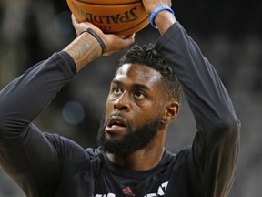 This Nov. 14, 2016 file photo shows Miami Heat forward Willie Reed (35) taking a practice shot before the start of an NBA basketball game against the San Antonio Spurs in San Antonio. (AP Photo/Ronald Cortes)