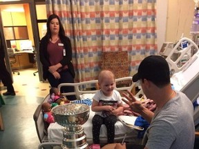 Sidney Crosby, right, visits with three-year-old Harper Saunders, who is being treated for leukemia, at a Halifax hospital in a Sunday, August 6, 2017, handout image. Crosby spent about an hour and a half roaming from room to room, visiting with kids and families and taking photos with "Stanley." (THE CANADIAN PRESS/HO)