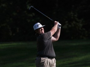 Patrick Newcomb makes his shot from the 17th fairway during the Oil Country Golf Tournament at the Windermere Golf & Country Club on August 6, 2017.