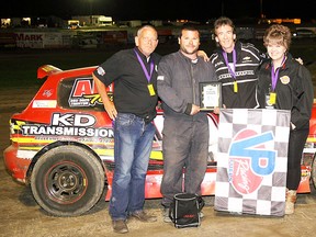 It was a long wait since opening night of the season, but series points-leader Tyler French (second from left) finally got back to Victory Lane in the Comp 4 class last weekend at Brighton Speedway. (Brighton Speedway photo)