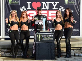 Martin Truex Jr., driver of the #78 Furniture Row/Denver Mattress Toyota, celebrates in victory lane after winning the Monster Energy NASCAR Cup Series I Love NY 355 at The Glen at Watkins Glen International on August 6, 2017 in Watkins Glen, New York. (Jared C. Tilton/Getty Images)