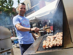 Gus Tsaprailis, a board member with the Hellenic Community of Sarnia and Vicinity, cooks up souvlaki at Greekfest Sunday. Thousands were expected to attend the annual celebration of Greek food and culture. Tyler Kula/Sarnia Observer/Postmedia Network