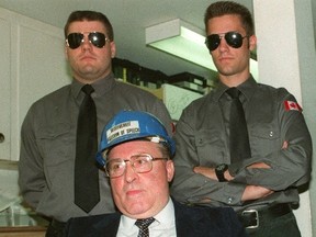 Ernst Zundel is flanked by supporters during an appearance in Toronto in a 1992 file photo. German authorities have confirmed that far-right activist Zundel, who was deported from Canada and served jail time in Germany for denying the Holocaust ever happened, has died. (THE CANADIAN PRESS/Bill Becker)