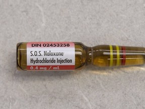 A vial containing naloxone, taken from an naloxone emergency kit is shown at a pharmacy in Toronto. (THE CANADIAN PRESS)