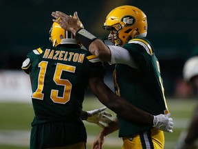 Edmonton Eskimos quarterback Mike Reilly (13) celebrates Vidal Hazelton's (15) touchdown against the Hamilton Tiger-Cats on Friday August 4, 2017, in Edmonton.