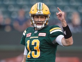 Edmonton Eskimos quarterback Mike Reilly (13) calls a play against the Hamilton Tiger-Cats during first half CFL action in Edmonton, Alta., on Friday August 4, 2017.
