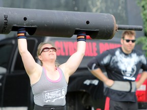 Crystal Wright competes in the 100-pound log press at Kingston’s Strongest Man and Woman 2017 event at Kingston Family Fun World on Saturday. Wright would later win the competition.