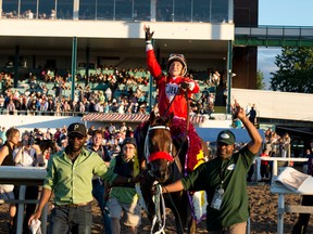 michael burns/photo
Jockey Luis Contreras celebrates after guiding Cool Catomine to victory in the $500,000 Prince of Wales Stakes on July 25 at Fort Erie. Next up — maybe — is the Breeders’ Stakes. (Michael Burns photo)