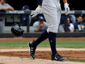 New York Yankees' Aaron Judge drops his batting helmet after striking out against the Tampa Bay Rays to end the third inning of a baseball game July 29, 2017, in New York. (JULIE JACOBSON/AP)