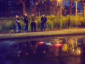 Emergency crews at the scene after a car rolled into Lake Ontario at Ashbridges Bay Park on Monday, Aug. 7, 2017. (Victor Biro/Special to the Toronto Sun)