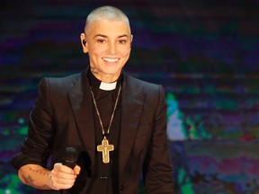 This is Oct. 5, 2014, file photo of Irish singer Sinead O'Connor performs during the Italian State RAI TV program "Che Tempo che Fa", in Milan, Italy. O'Connor emotionally pleaded for help and opened up about her struggles with mental illness in a rambling Facebook video posted on Aug. 3,
2017. A follow-up Facebook said to be made on O’Connor’s behalf late Monday said the singer was OK. (AP Photo/Antonio Calanni, File)