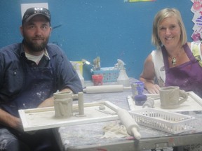 Tom and Katie Thompson make coffee mugs for their anniversary during the Evermore Artistry open studio session on Aug. 2 (Joseph Quigey | Whitecourt Star).