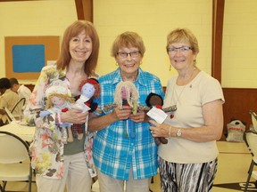 Linda Woods, Laurel Kelley and Sarnia's Ann Carr hold up several Dolls of Hope during a workshop in Dunlop United Church on Aug. 1. The dolls will be given to the 338 MPs in Ottawa on Nov. 21 as part of the United Church's Bread Not Stones campaign to end child poverty.
CARL HNATYSHYN/SARNIA THIS WEEK