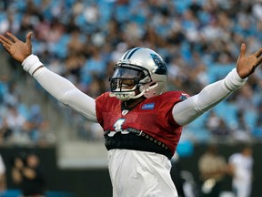 Carolina Panthers’ Cam Newton (1) plays to the crowd during practice at the team’s Fan Fest in Charlotte, N.C., Friday, Aug. 4, 2017. (AP Photo/Chuck Burton)