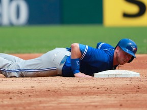 Toronto Blue Jays' Justin Smoak lies on the ground after being tagged out during an MLB game against the Chicago White Sox in Chicago on Aug. 2, 2017. (AP Photo/Jeff Haynes)