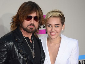 Billy Ray Cyrus (L) and Miley Cyrus. (FREDERIC J BROWN/AFP/Getty Images)