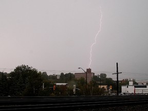 Lightning lights up the sky over the downtown area during a thunderstorm in Sudbury on Tuesday. The city was under a severe thunderstorm watch for much of the day. The bad weather knocked over trees and disrupted power to many parts of the city. Rain is forecast for the rest of the week with seasonal temperatures.