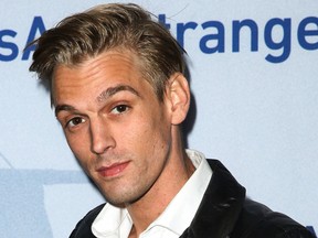 In this Nov. 9, 2015, file photo, singer Aaron Carter arrives at a premiere of "Saints & Strangers" at the Saban Theater in Beverly Hills, Calif. Authorities said Carter and his girlfriend Madison Parker were arrested Saturday, July 15, 2017, on DUI and drug charges in Georgia. (Photo by Rich Fury/Invision/AP, File