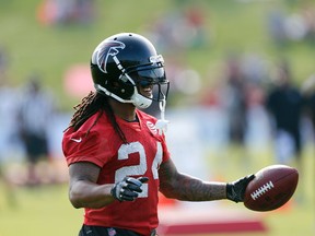 Atlanta Falcons running back Devonta Freeman reacts during training camp Thursday, July 27, 2017, in Flowery Branch, Ga. (AP Photo/John Bazemore)